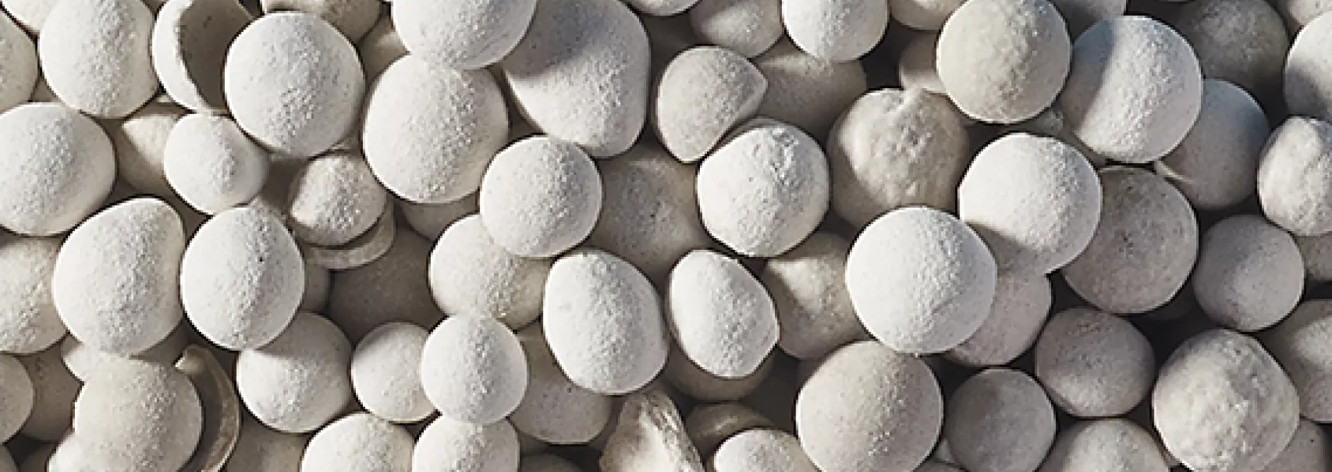 close up on white balls granulates representing Sorbacal H product