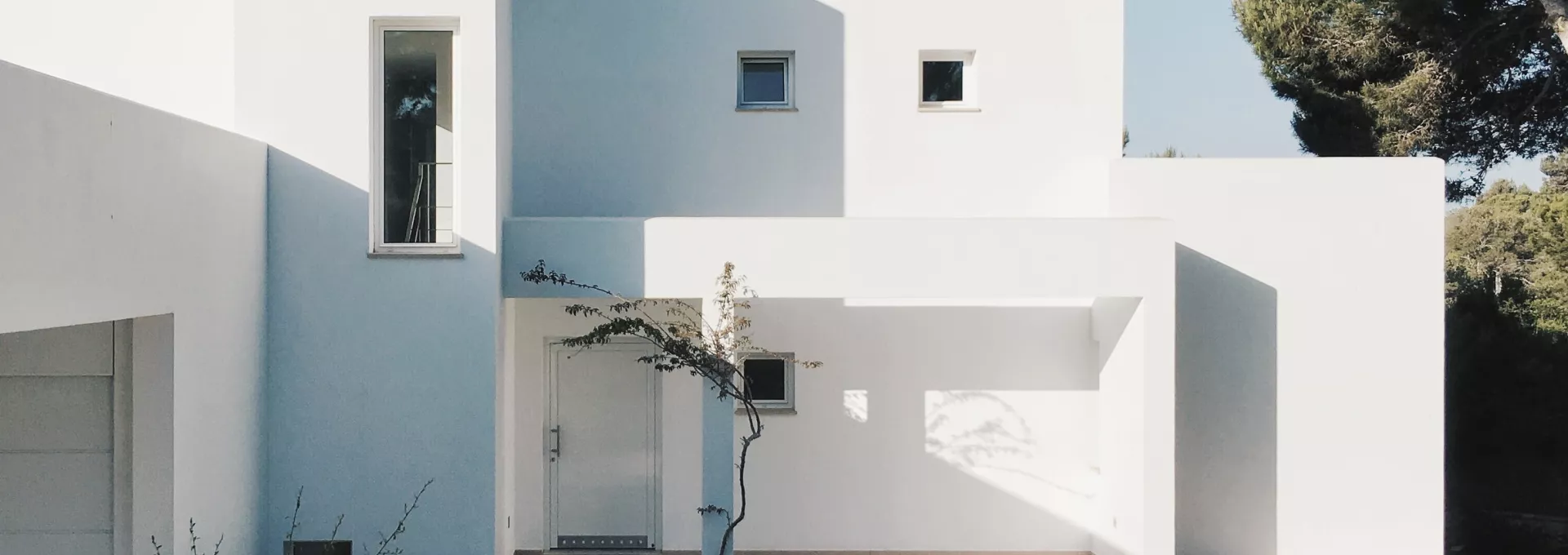 Big designer white house with a sunny sky