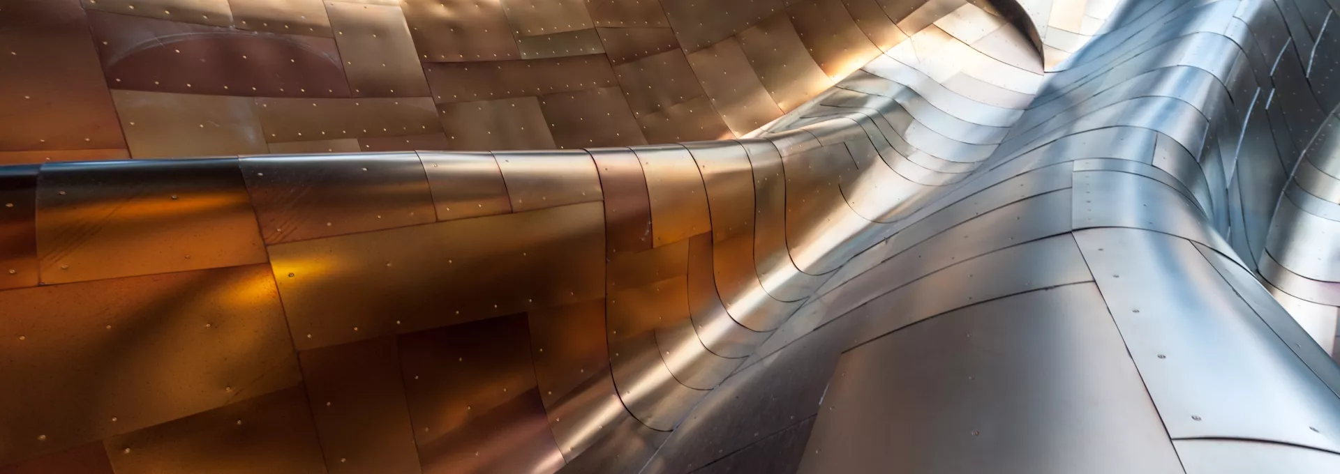 rounded titanium structure with an orange reflection