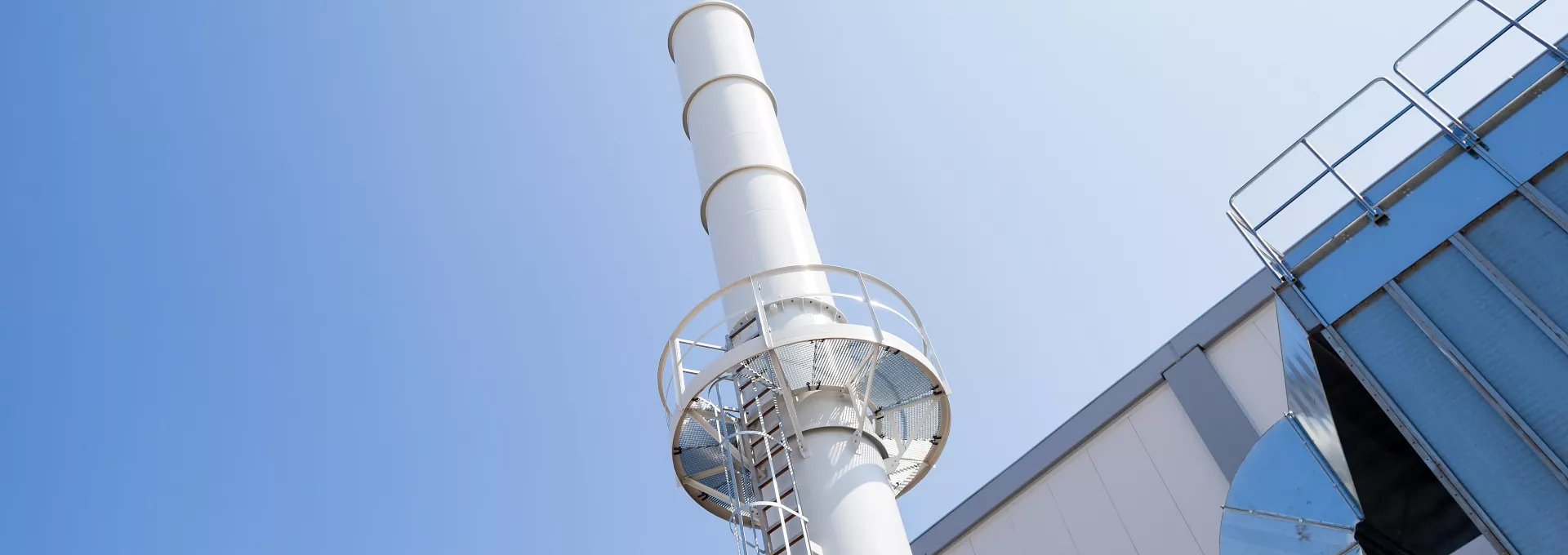 Close-up on a flue gas treatment factory chimney