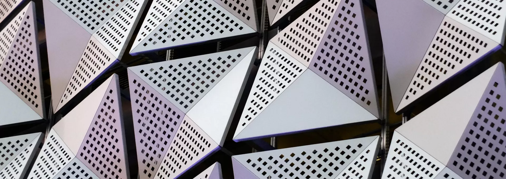silver geometric steel cladding with angular patterns