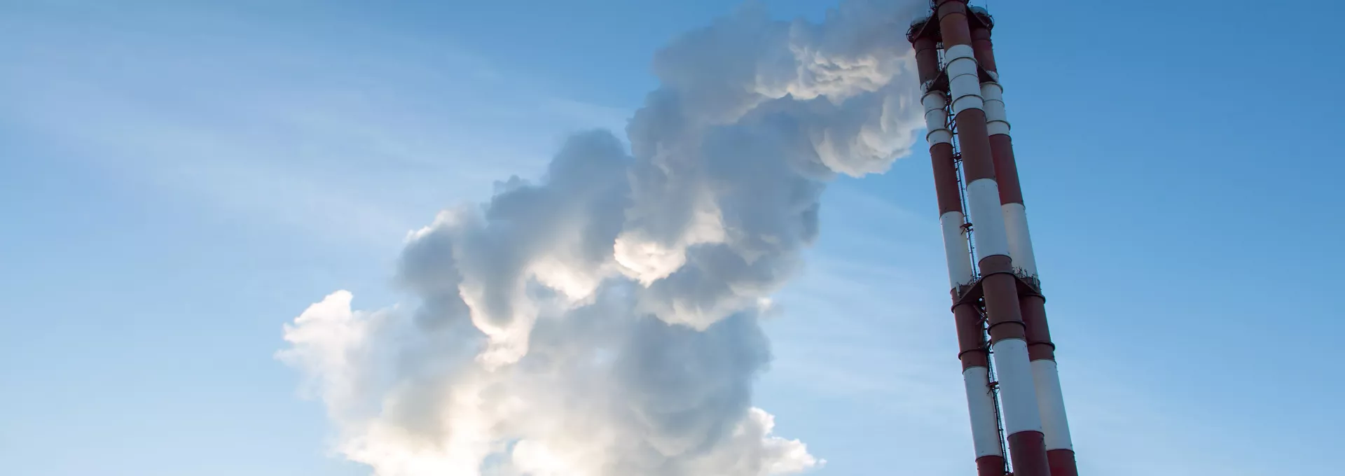 close-up on smoke and steam from a plant boiler tube