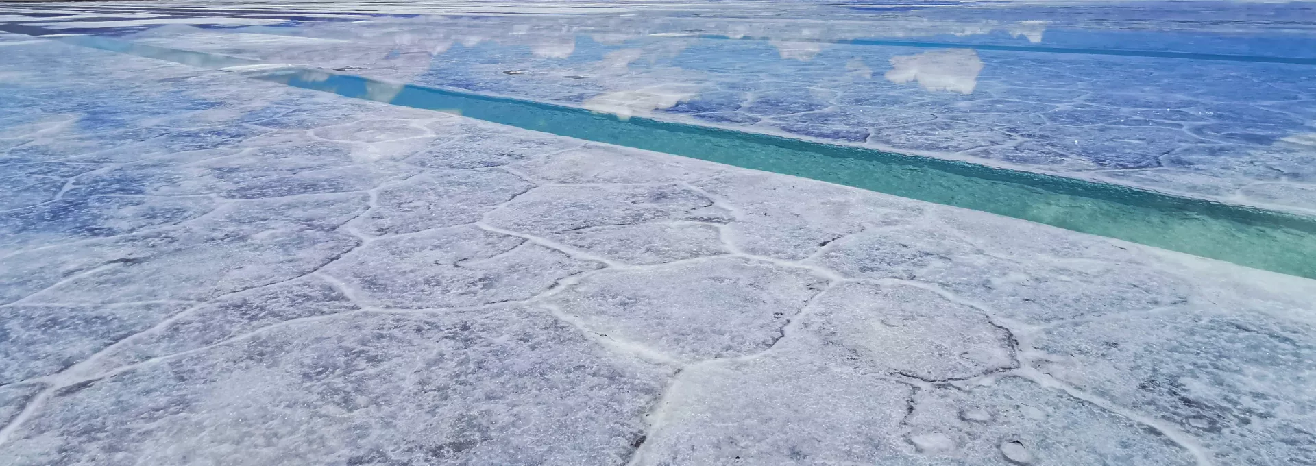 overview of a salt desert landscape with a beautiful blue sky
