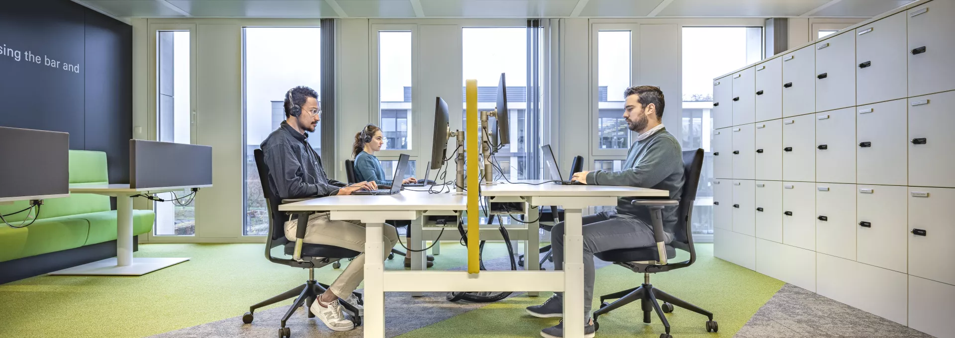 Young people working in an office in front of computer