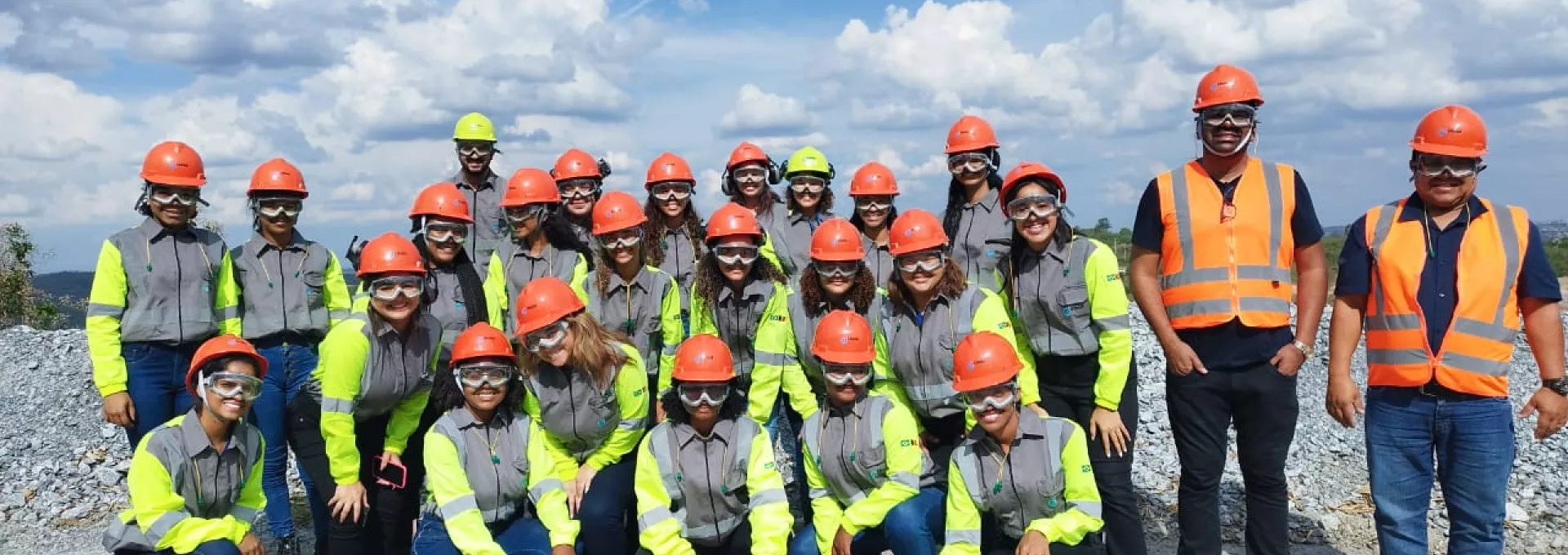 group of young women in front of a quarry