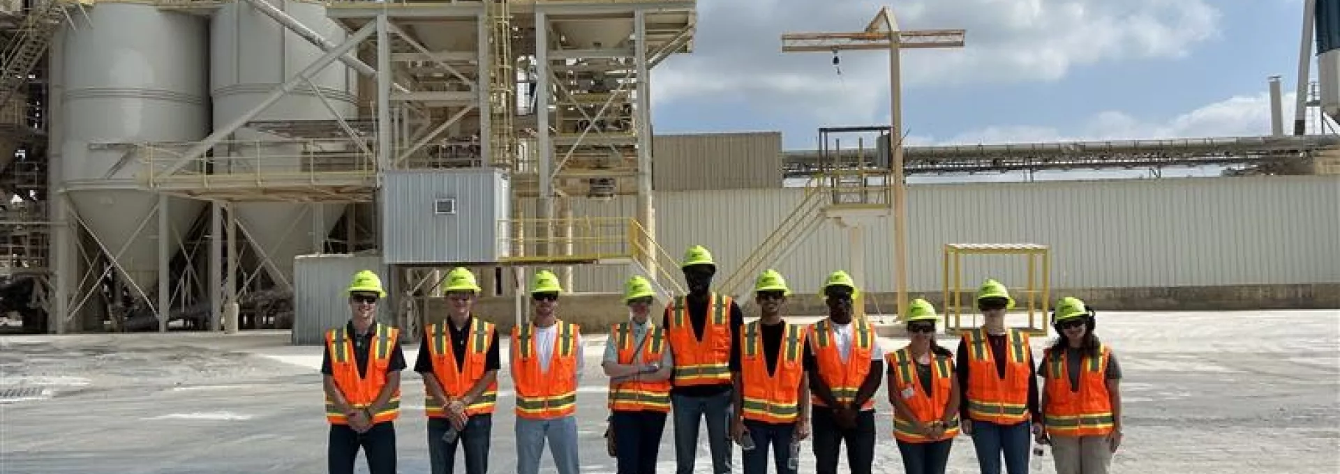 a group of young people in front of lime plant