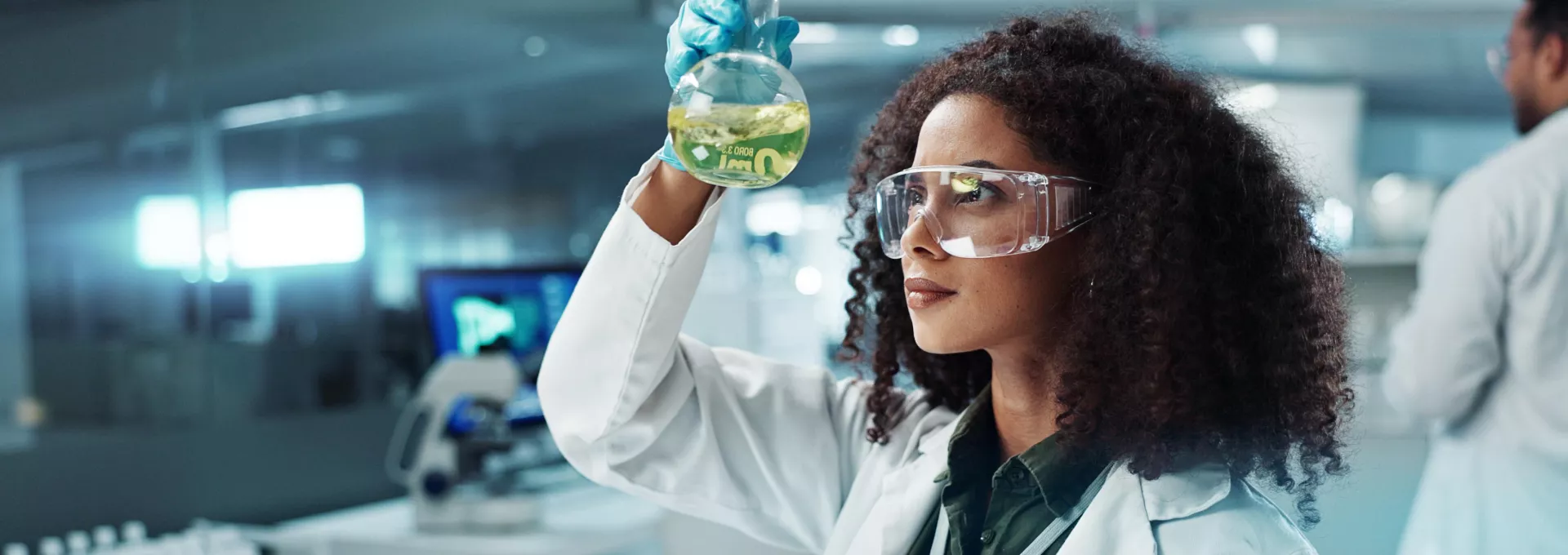 Scientist, woman and chemical with laptop in laboratory for chemistry experiment, test sample and research. Science
