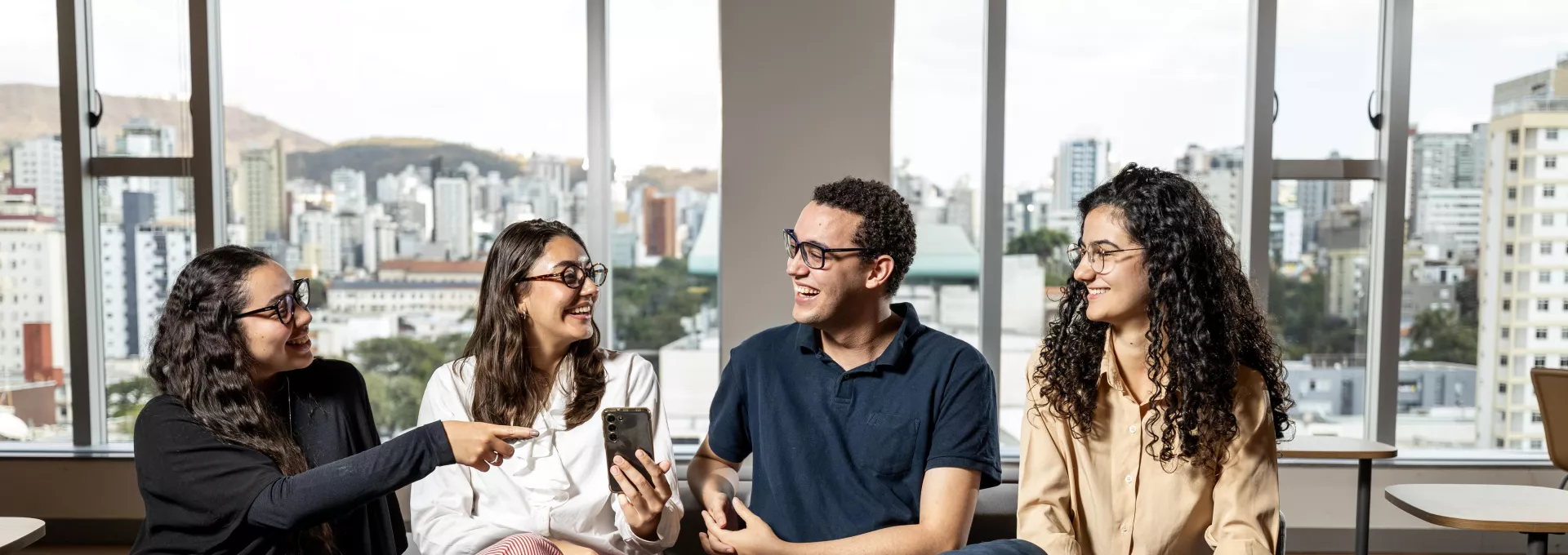 Group of young adults working together in an office