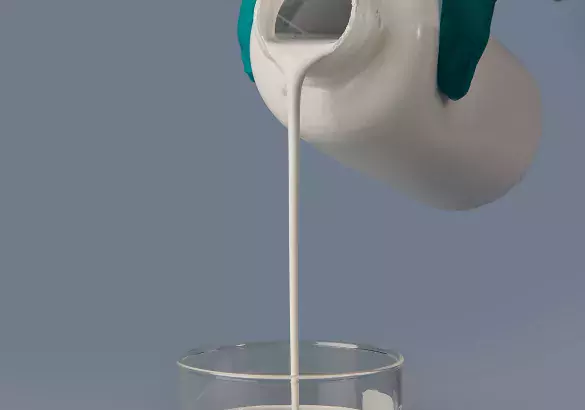 adding a milk of lime to a laboratory container