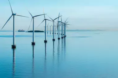 Wind mills on the sea with blue sky
