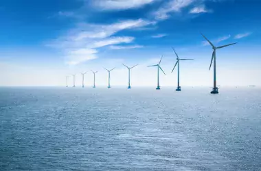 Wind mills in the sea with blue sky