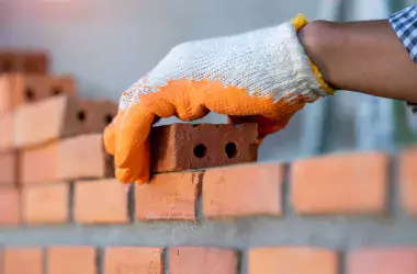 hand with bricks
