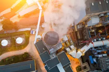 View from the top with smoke comes out of the chimneys of the power plant