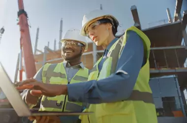 employees on site looking at a computer