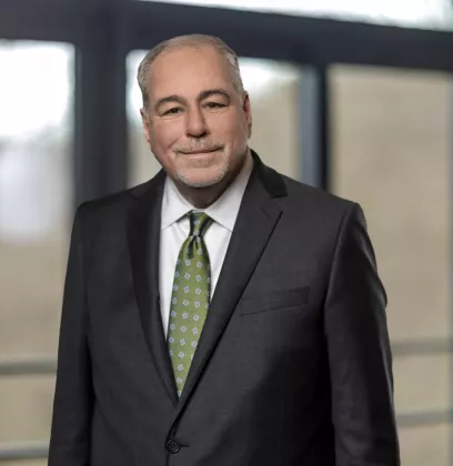 Man in grey business wear with tie
