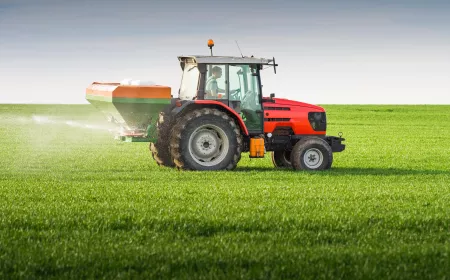 tractor fertilizing a field