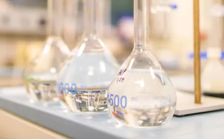 3 laboratory containers with water