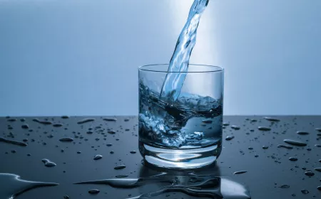 a glass that fills with a flow of water