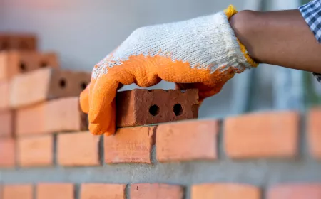 hand with bricks