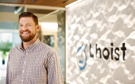 Man in front of Lhoist logo