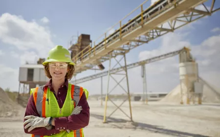 Young women worker smiling in a middle of a plant
