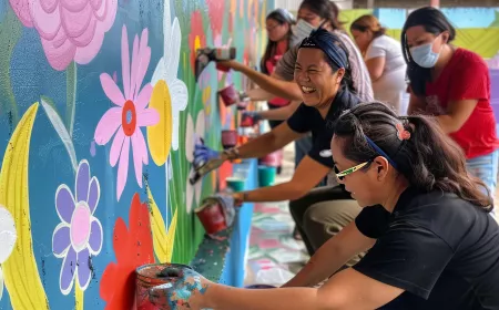 people drawing on a wall as community action