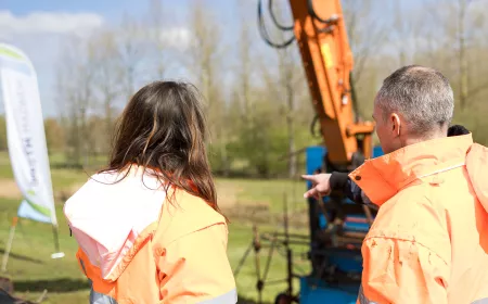 two engineers on a wave impact testing looking to the work
