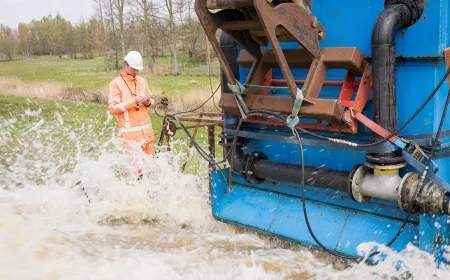 Wave impact testing at Vlassenbroek - a worker is doing test in water