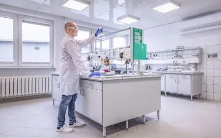 Laboratory technician conducting analysis in a research and development laboratory equipped with scientific instruments and testing equipment.