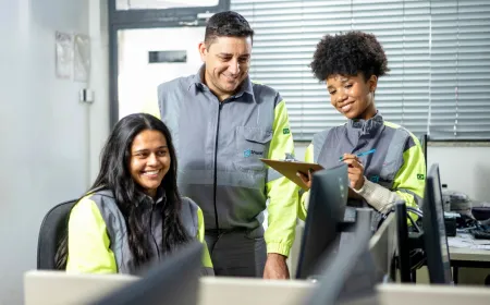Three people working in office Brazil